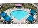 Aerial view of a community pool featuring blue sunshades, lounge chairs and meticulous landscaping at 1350 S Greenfield Rd # 1166, Mesa, AZ 85206