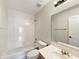 A bathroom with a tub and shower combination, tile surround, vanity, and toilet at 14235 W Shawnee Trl, Surprise, AZ 85374