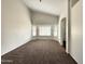 Spacious bedroom with carpet, large windows, and ample natural light at 14235 W Shawnee Trl, Surprise, AZ 85374