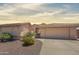 Charming single-story home with a well-maintained yard and a two-car garage at 14235 W Shawnee Trl, Surprise, AZ 85374