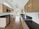 Bright kitchen featuring stainless steel appliances and tile flooring, ideal for modern cooking at 14235 W Shawnee Trl, Surprise, AZ 85374