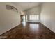 Bright, airy living room with tile floors and sliding glass doors to the backyard at 14235 W Shawnee Trl, Surprise, AZ 85374