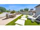 Spacious outdoor patio with dining and lounge areas, perfect for entertaining at 1462 E Sweet Citrus Dr, Queen Creek, AZ 85140