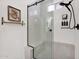 Modern bathroom with frameless shower, bench seat, and sleek black hardware at 1462 E Sweet Citrus Dr, Queen Creek, AZ 85140