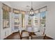 Charming breakfast nook with large windows, views of the backyard, and a modern light fixture at 1462 E Sweet Citrus Dr, Queen Creek, AZ 85140