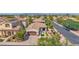 Aerial view of a single-Gathering home featuring desert landscaping, a private courtyard, and a two-car garage at 1462 E Sweet Citrus Dr, Queen Creek, AZ 85140