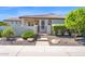 Inviting property entrance with desert landscaping and stylish fence at 1462 E Sweet Citrus Dr, Queen Creek, AZ 85140
