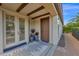 Welcoming front porch with decorative plants and stylish entryway at 1462 E Sweet Citrus Dr, Queen Creek, AZ 85140