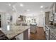 Spacious kitchen with ample counter space, an island, stainless appliances, and natural light at 1462 E Sweet Citrus Dr, Queen Creek, AZ 85140
