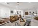 Bright and airy living room featuring modern decor and a comfortable seating arrangement at 1462 E Sweet Citrus Dr, Queen Creek, AZ 85140