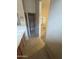 Bathroom featuring tile floors, a vanity, toilet, and carpeted bedroom at 1546 W Vaughn Ave, Gilbert, AZ 85233