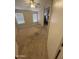 An empty bedroom featuring neutral carpet, a window, and ensuite access at 1546 W Vaughn Ave, Gilbert, AZ 85233