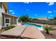 Backyard pool, hot tub and outdoor kitchen with mature landscaping and clear skies at 1638 N Avoca --, Mesa, AZ 85207