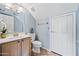 Bathroom features a single sink vanity, toilet, and large mirror at 1638 N Avoca --, Mesa, AZ 85207
