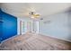 Large bedroom with a neutral palette, ceiling fan, and glass french doors at 1638 N Avoca --, Mesa, AZ 85207