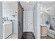 Hallway leads to bathroom and laundry room with barn door at 1638 N Avoca --, Mesa, AZ 85207