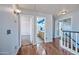 Upstairs hallway with wood floors that offers a view of additional rooms and a staircase at 1638 N Avoca --, Mesa, AZ 85207