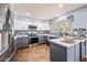 Bright updated kitchen features stainless appliances, gray cabinets, white uppers and eat in island at 1638 N Avoca --, Mesa, AZ 85207