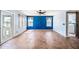 Spacious living area featuring tile floors, natural light, and blue accent wall at 1638 N Avoca --, Mesa, AZ 85207