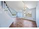The living room features a large staircase and lots of windows for ample natural light at 1638 N Avoca --, Mesa, AZ 85207