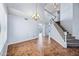 Bright and airy living room showcasing a staircase and elegant chandelier at 1638 N Avoca --, Mesa, AZ 85207