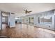 Living room with tile floors, large windows and view of kitchen and dining area at 1638 N Avoca --, Mesa, AZ 85207