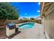 Pool and outdoor kitchen area with built-in grill and beautiful sky at 1638 N Avoca --, Mesa, AZ 85207
