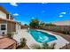 Backyard pool with well-maintained landscaping and clear blue skies above at 1638 N Avoca --, Mesa, AZ 85207