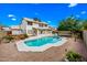 Backyard pool with mature landscaping and a large two-story home at 1638 N Avoca --, Mesa, AZ 85207