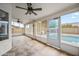 Enclosed sunroom that includes a ceiling fan and large windows with a view of the outdoor pool at 1638 N Avoca --, Mesa, AZ 85207