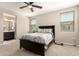 This is a bedroom with neutral carpeting, a ceiling fan, and two windows letting in natural light at 1849 E Chelsea Ln # 107, Gilbert, AZ 85295