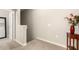 Hallway with beige carpet, white walls, and access to other rooms at 1849 E Chelsea Ln # 107, Gilbert, AZ 85295