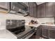 Well-equipped kitchen with stainless steel appliances, sleek countertops, and ample cabinet space at 1849 E Chelsea Ln # 107, Gilbert, AZ 85295