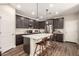 Open kitchen with island, quartz counters, stainless steel appliances and barstool seating at 1849 E Chelsea Ln # 107, Gilbert, AZ 85295