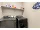 Well-equipped laundry room with modern washer and dryer units at 1849 E Chelsea Ln # 107, Gilbert, AZ 85295