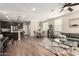 Open-concept living space with wood-look tile, modern lighting, and neutral decor at 1849 E Chelsea Ln # 107, Gilbert, AZ 85295