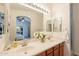 Bathroom with double sinks, wood cabinets, and neutral paint for a modern look at 1851 E Ellis St, Phoenix, AZ 85042