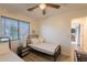 Bedroom with twin beds, ceiling fan, and view to an open door at 1851 E Ellis St, Phoenix, AZ 85042