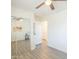 Bedroom with wood-look floors, closet with mirrored doors and ceiling fan at 1851 E Ellis St, Phoenix, AZ 85042