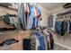 Walk-in closet with built-in shelves and hanging racks for ample storage at 1851 E Ellis St, Phoenix, AZ 85042
