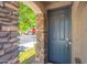 Inviting front door with stone accents, a secure lock, and well-maintained surroundings at 1851 E Ellis St, Phoenix, AZ 85042