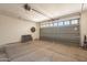 Spacious two car garage with opener, door to house, and natural light at 1851 E Ellis St, Phoenix, AZ 85042