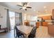 View of kitchen with stainless steel appliances and an adjacent dining area with large sliding glass door at 1851 E Ellis St, Phoenix, AZ 85042