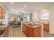 Bright, open kitchen with modern appliances and a view into the dining and living area at 1851 E Ellis St, Phoenix, AZ 85042