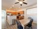 Open kitchen with wooden cabinets, stainless steel appliances and an adjacent dining area at 1851 E Ellis St, Phoenix, AZ 85042