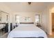 Spacious main bedroom with wood bed frame, and neutral decor for a relaxing ambiance at 1851 E Ellis St, Phoenix, AZ 85042