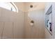 Modern bathroom shower with tiled walls, and built-in shelves at 1851 E Ellis St, Phoenix, AZ 85042