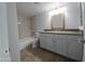 Updated bathroom features granite countertops, neutral paint, and shower over tub at 200 E Southern Ave # 363, Tempe, AZ 85282