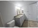 Clean bathroom with modern vanity, granite countertop, framed mirror and tile flooring at 200 E Southern Ave # 363, Tempe, AZ 85282