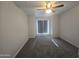 Comfortable bedroom with ceiling fan, neutral carpet, and ample natural light at 200 E Southern Ave # 363, Tempe, AZ 85282